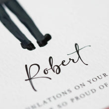 a close-up of a person's legs wearing black shoes, with the name "Robert" written in cursive below them.