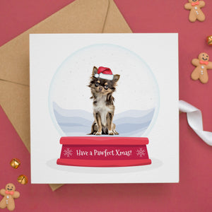 a card with a dog inside of a snow globe