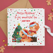 a christmas card with two bears and a christmas tree