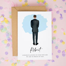 a greeting card with a man in a suit standing against a blue background, surrounded by confetti.