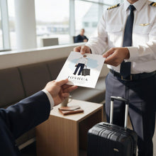 A person in a pilot uniform is handing a paper to another person, who is holding a suitcase, in an airport setting.