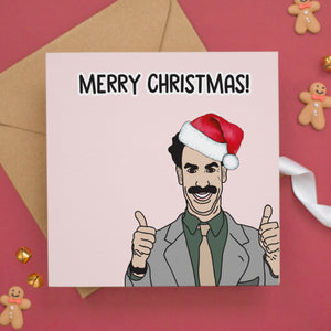 a card with a picture of a man wearing a santa hat