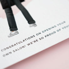 a close-up of a person's legs wearing black pants and white shoes, with text that congratulates the opening of a salon.