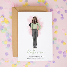 A greeting card with a woman's back facing the viewer, surrounded by confetti on a pink background.