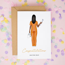 a card with an illustration of a woman in orange scrubs, holding a stethoscope, and the text "Congratulations Doctor Shay" written below the illustration.